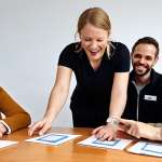 ** A diverse group of people collaborating on a community project, showcasing a "verbinder" (connector), an "organisator" (organizer), and a "communicator" actively working together. Focus on enthusiasm and collaboration.

**